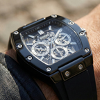 ساعة Guess Phoenix GW0203G3 بهيكل مطاطي أسود وعلامات فضية وميناء بهيكل شفاف
