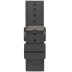 ساعة Guess Odyssey W1108G6 بهيكل بلون رصاصي داكن، ومينا أزرق سماوي، وحزام مطاطي رمادي