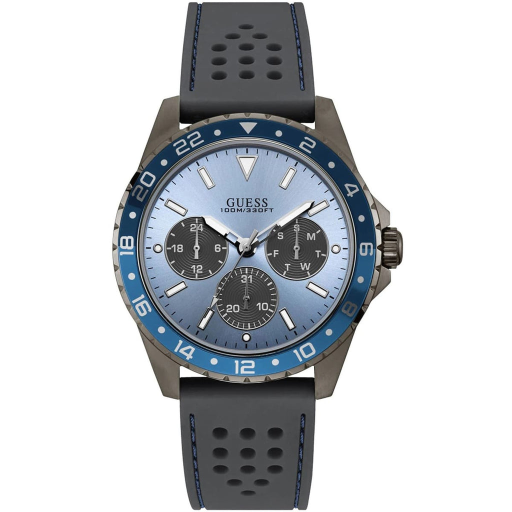ساعة Guess Odyssey W1108G6 بهيكل بلون رصاصي داكن، ومينا أزرق سماوي، وحزام مطاطي رمادي