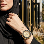 ساعة أثينا متعددة الوظائف GW0030L2 بإطار ذهبي ومينا ذهبي وحزام مطاطي أسود للنساء