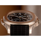 Patek Philippe Men’s Aquanaut Travel Time Rose Gold Brown Dial Watch